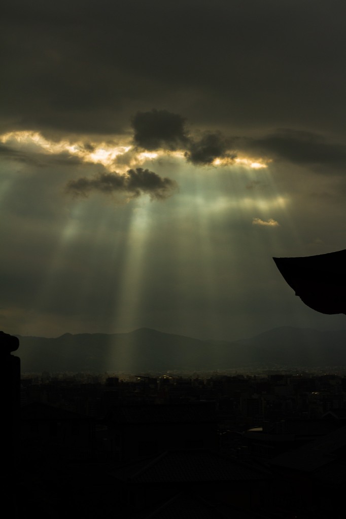 Freelance photography — god rays over a silhouetted skyline