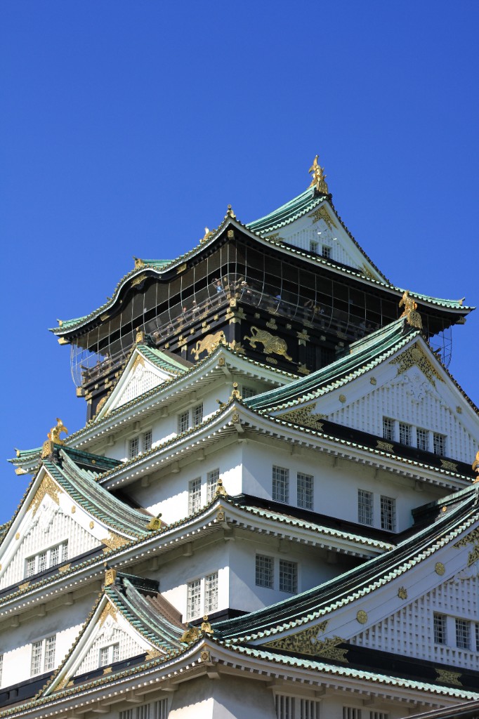 Architecture — Osaka Castle tower against blue sky